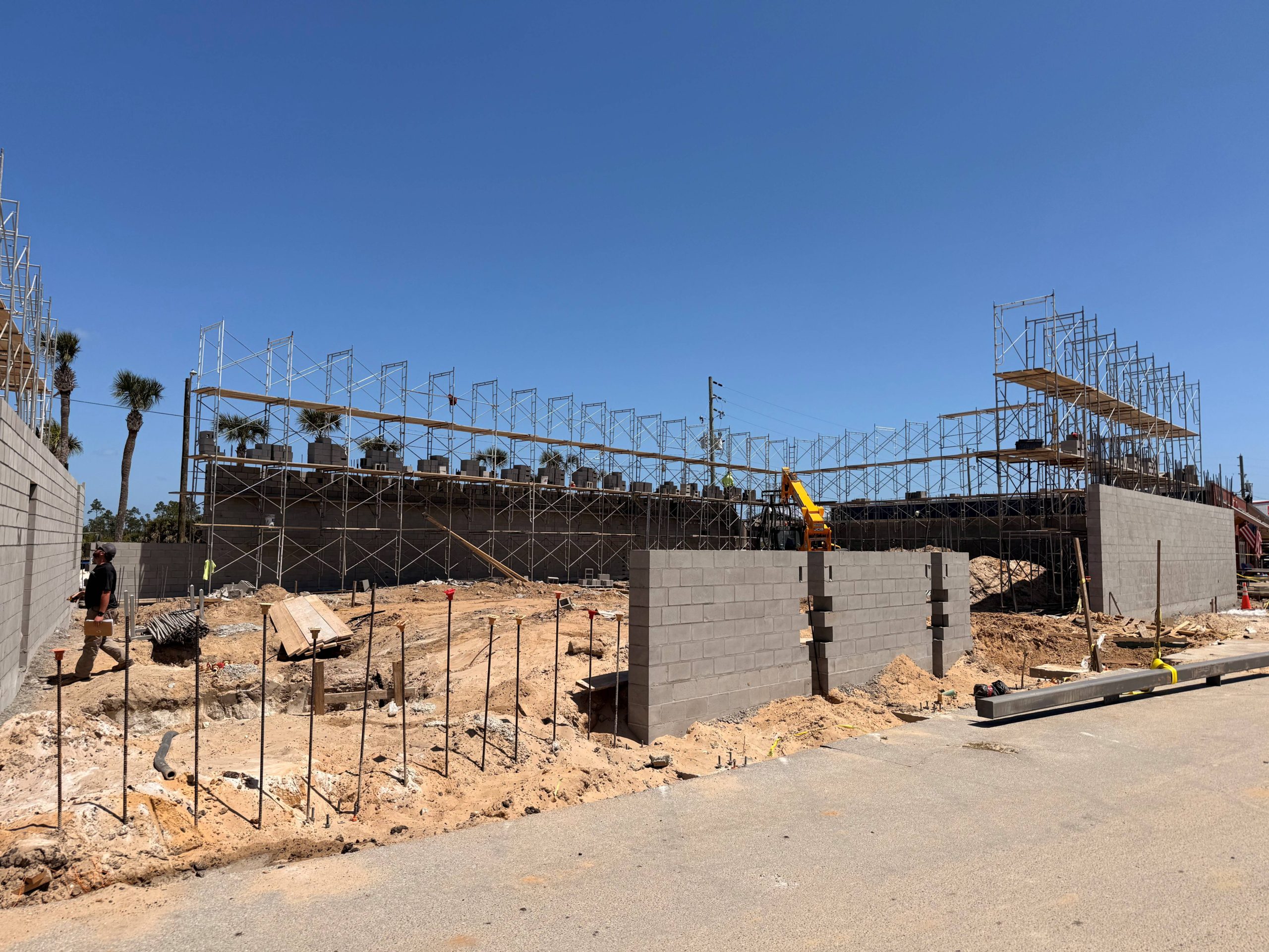 Fresh construction site putting up foundation and concrete walls